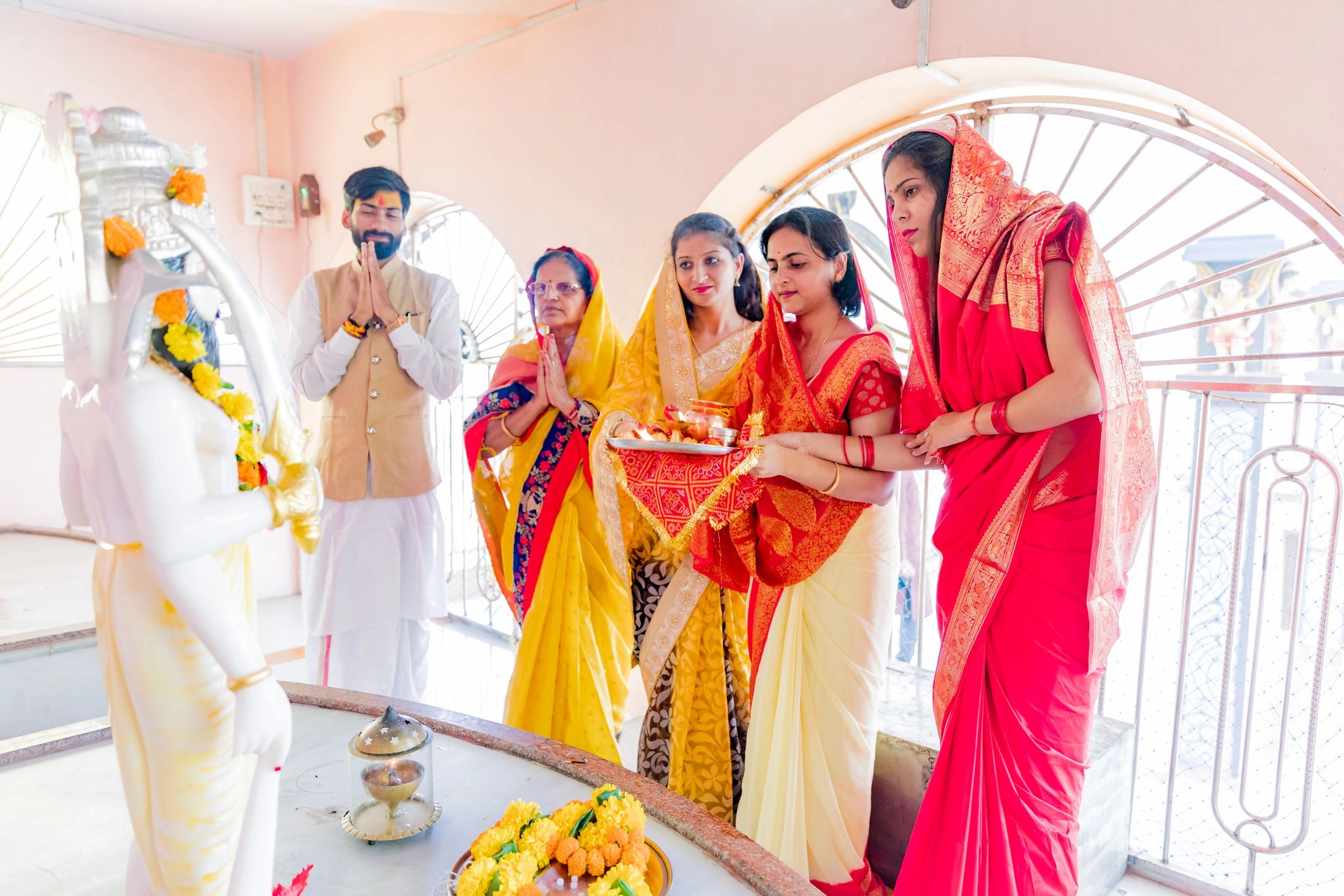 Hindu women praying at a temple